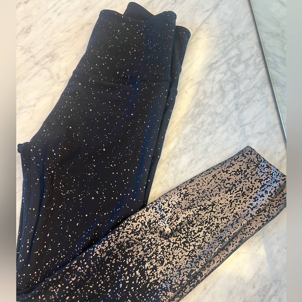 Beyond Yoga Black with Gold High-Rise leggings. Purchased at Aria  Spa. Size M.